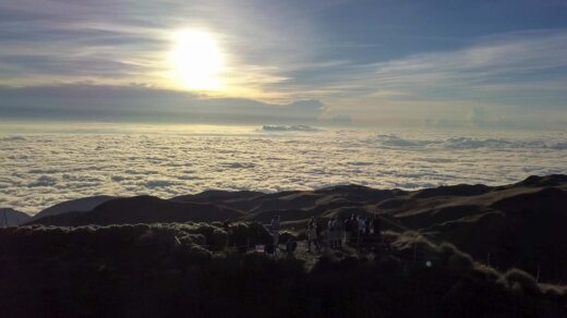 Aerial view of hikers watching sunrise at mount pulag