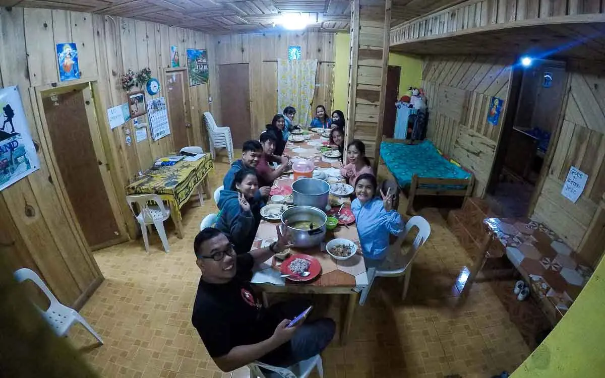 Hikers having a meal inside Dencio’s Homestay near Mount Pulag
