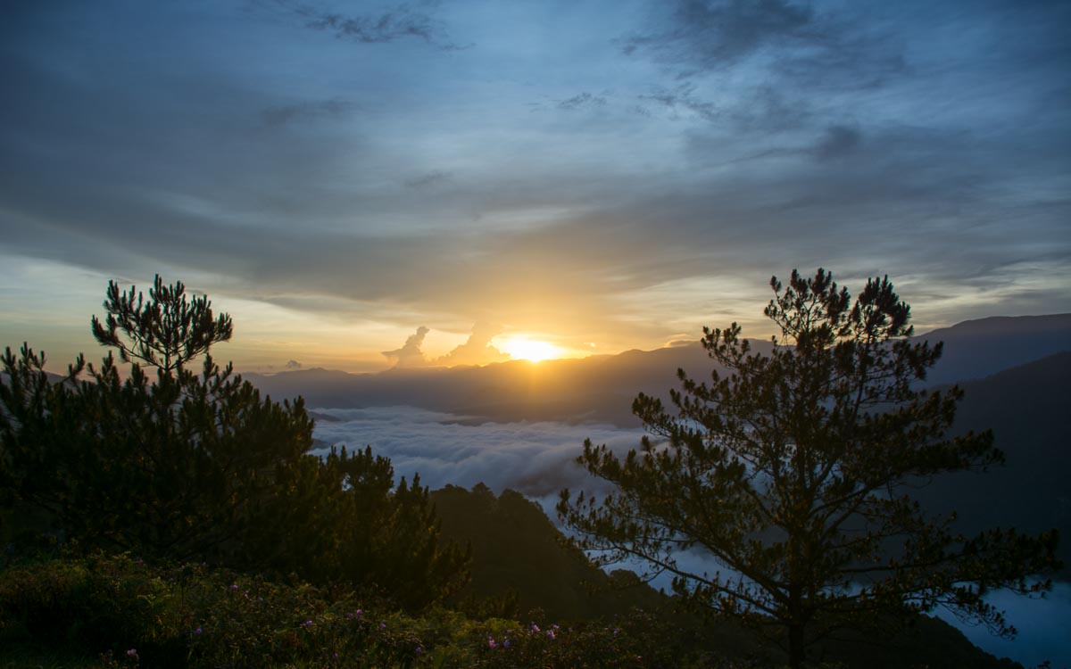 Golden hour sunrise at Kamanbaneng Peak Marlboro Hills with warm morning light breaking through clouds