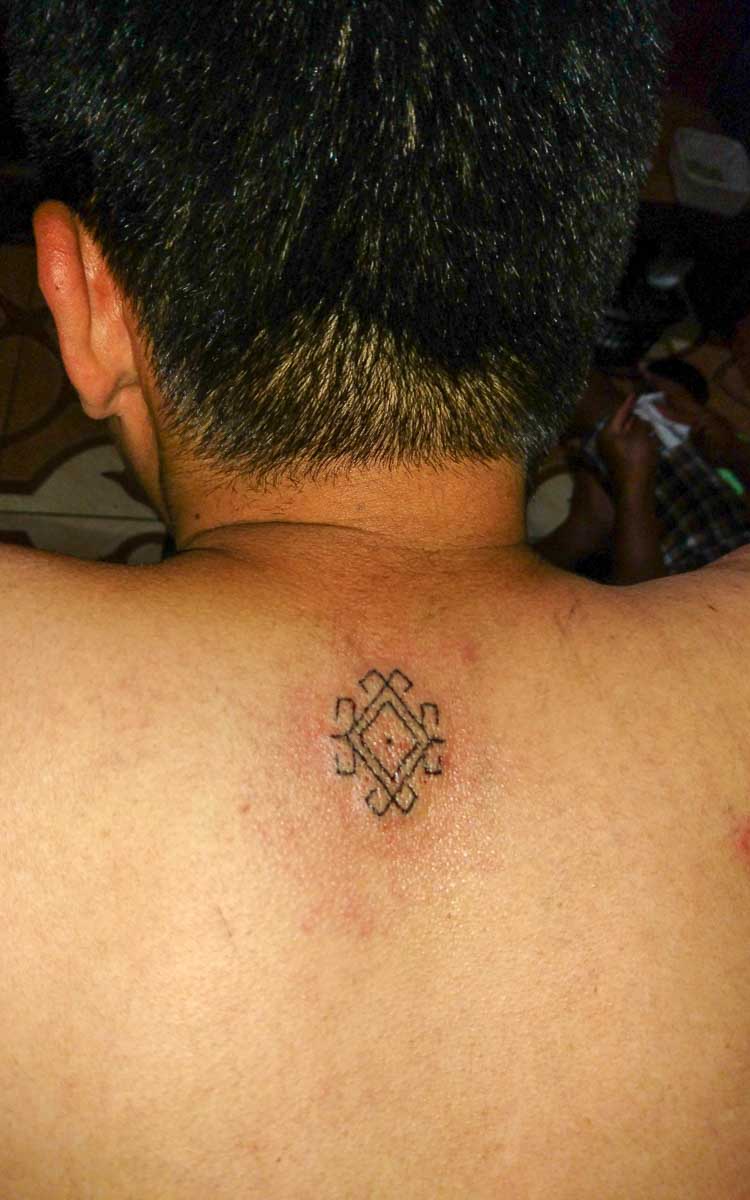 Traditional traveler symbol tattoo design from Buscalan village Kalinga