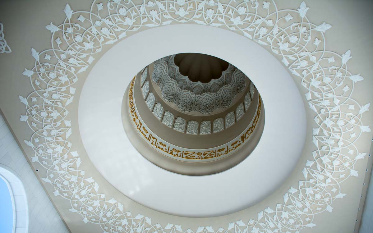 Intricate Islamic geometric patterns and calligraphy on Sheikh Zayed Mosque ceiling dome