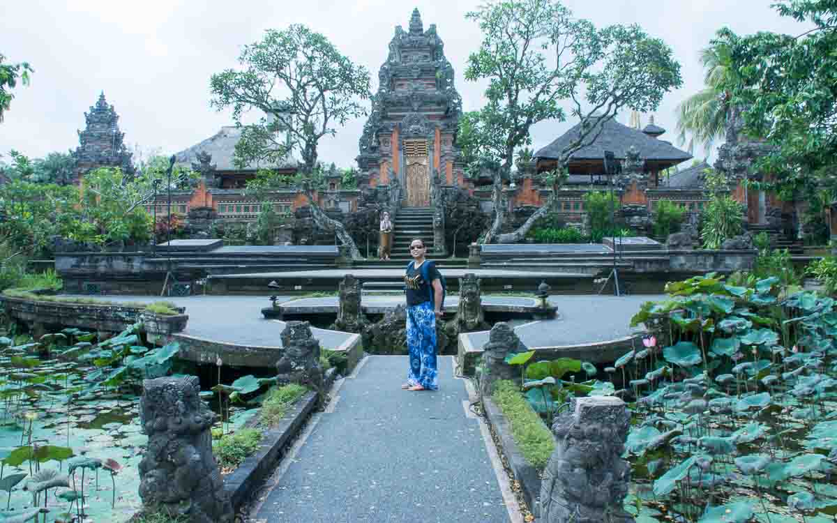 Beautiful sacred lotus pond at Saraswati Temple in Ubud, Bali with traditional Balinese temple architecture and blooming lotus flowers