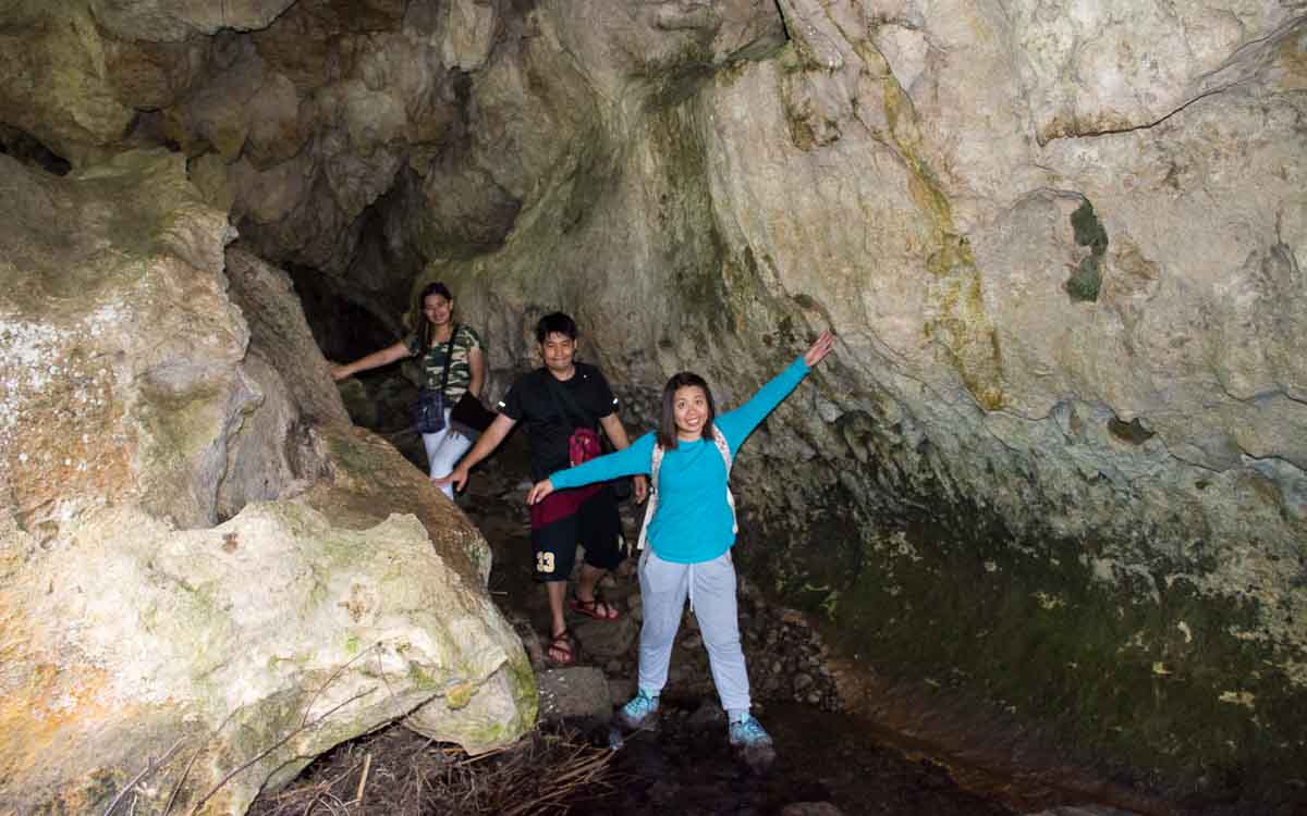 Alex, Nathaniel, and Hanah inside the underground river cave