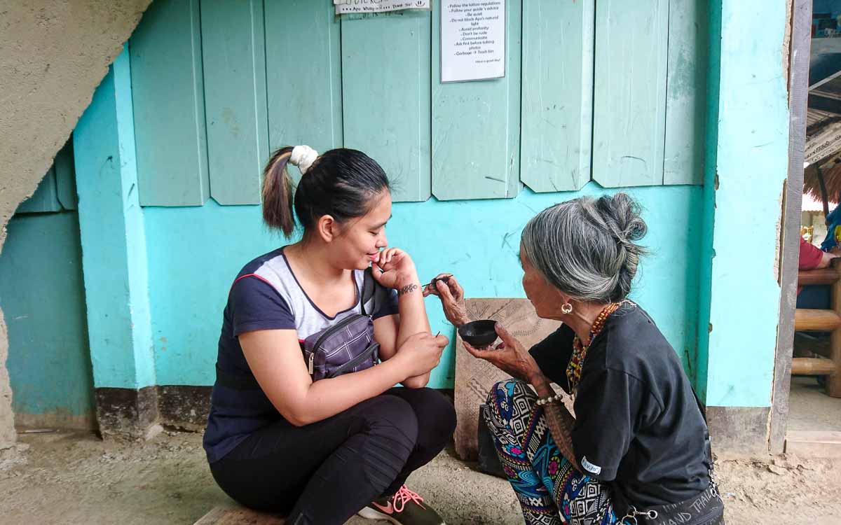 Hanah getting a tattoo from Apo Whang-od