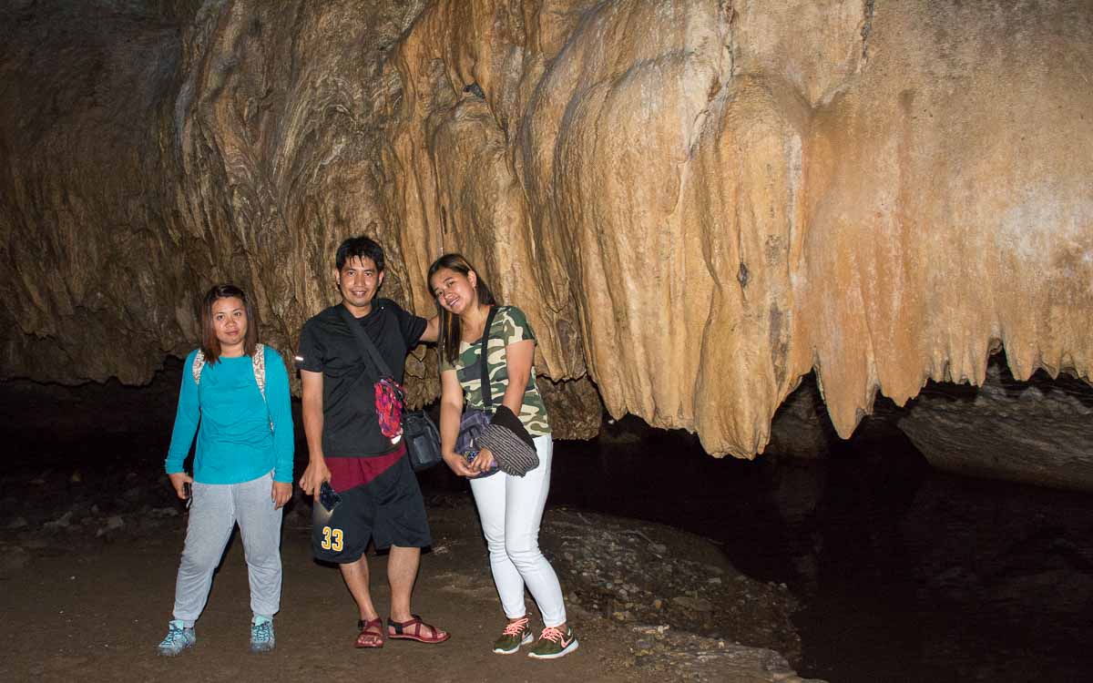 Hanah, Nathaniel, and Alex exploring the underground river cave