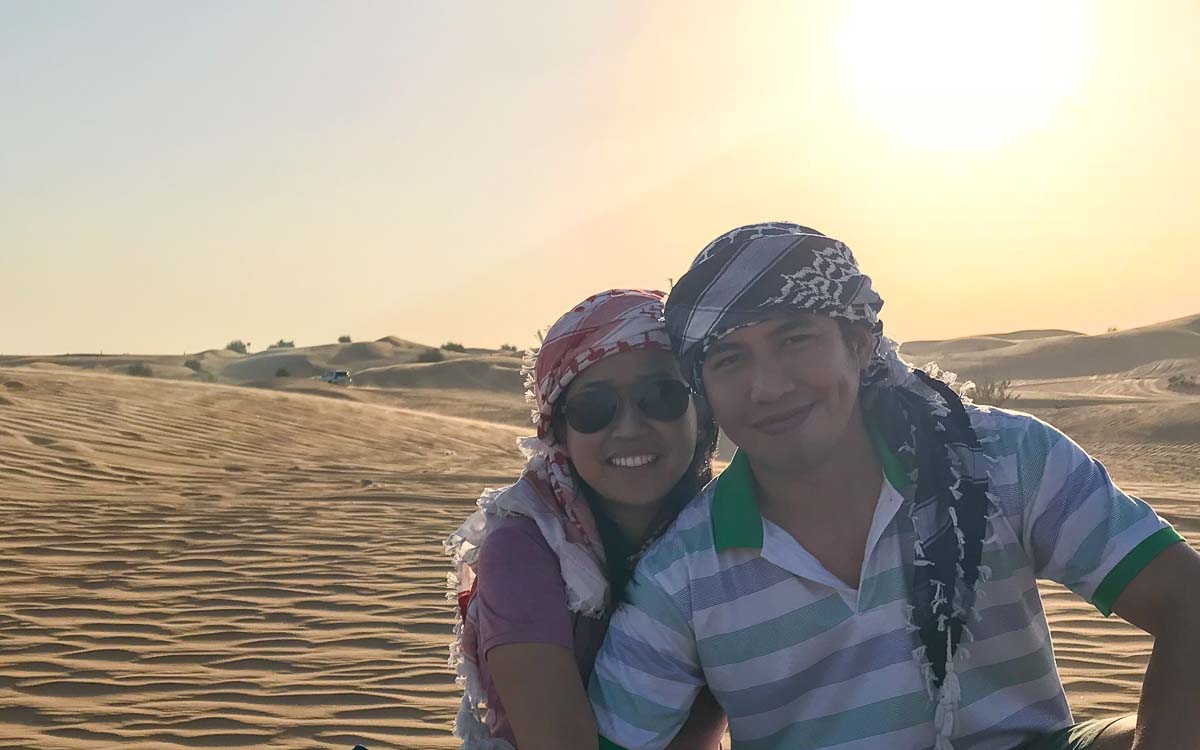 Couples at sand dunes in Dubai