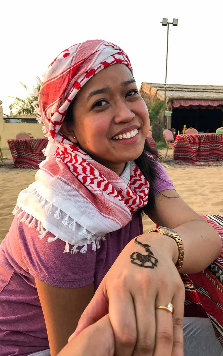 Joanna displaying a flower henna tattoo in desert safari camp