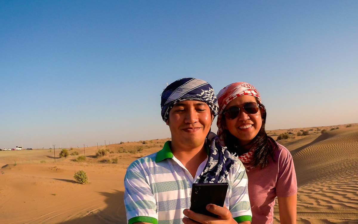 Couples at sand dunes in Dubai