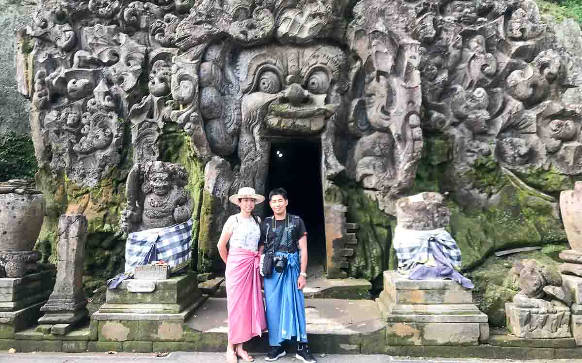 Ancient demon-faced stone entrance to Goa Gajah elephant cave temple in Ubud Bali