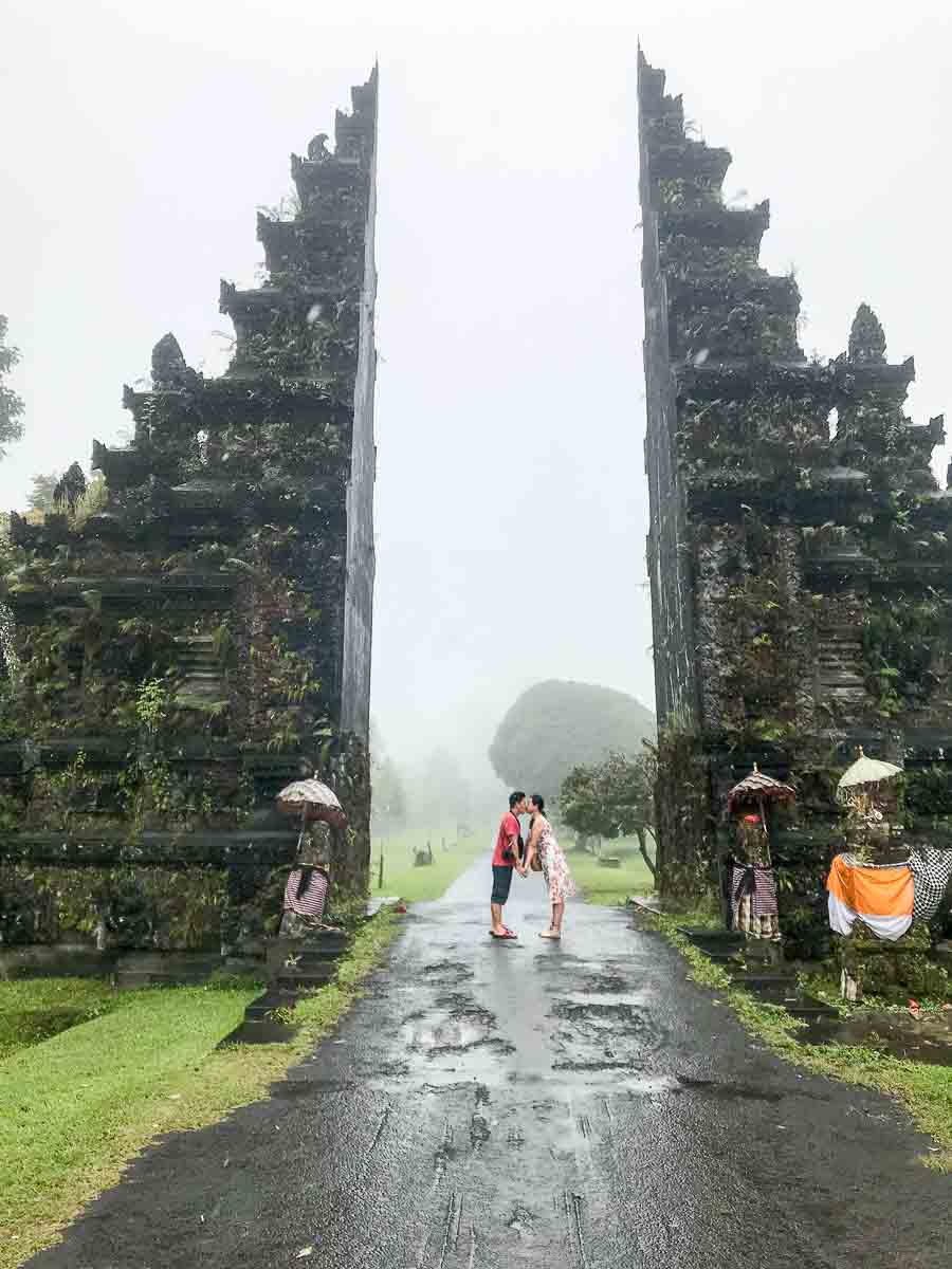 Traditional Balinese gate at Handara framed by towering pine trees