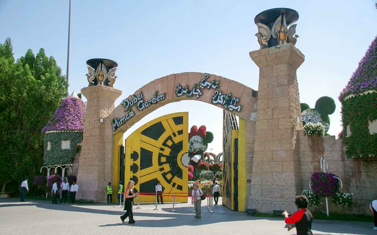 Dubai Miracle Garden entrance gate with ticket booth and visitor information signage