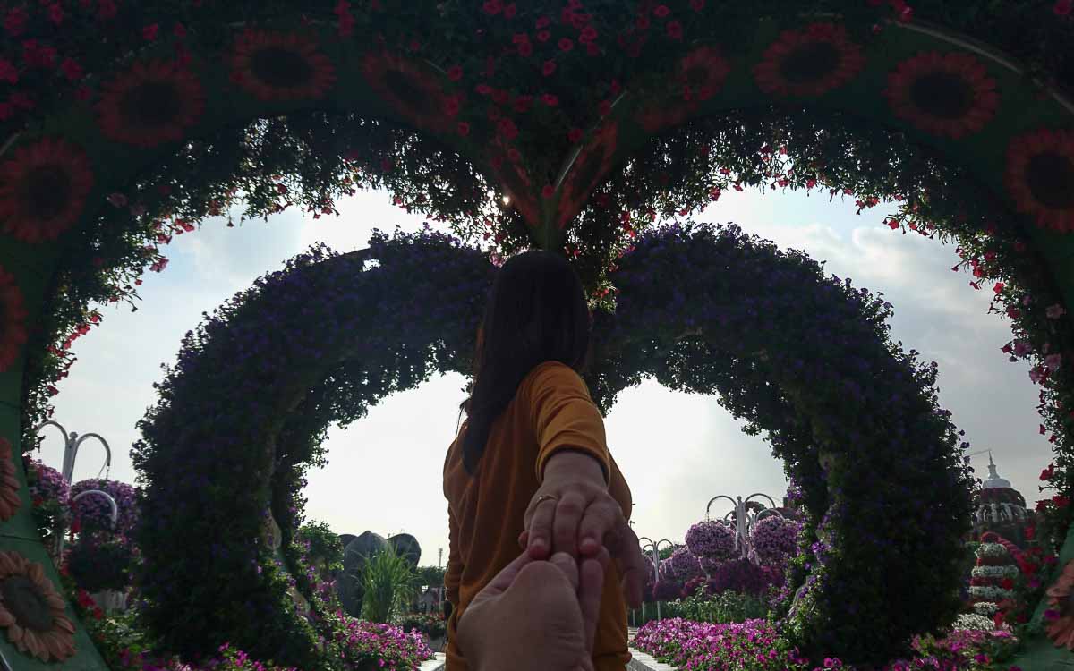 Heart-shaped floral arches creating a romantic tunnel pathway at Dubai Miracle Garden