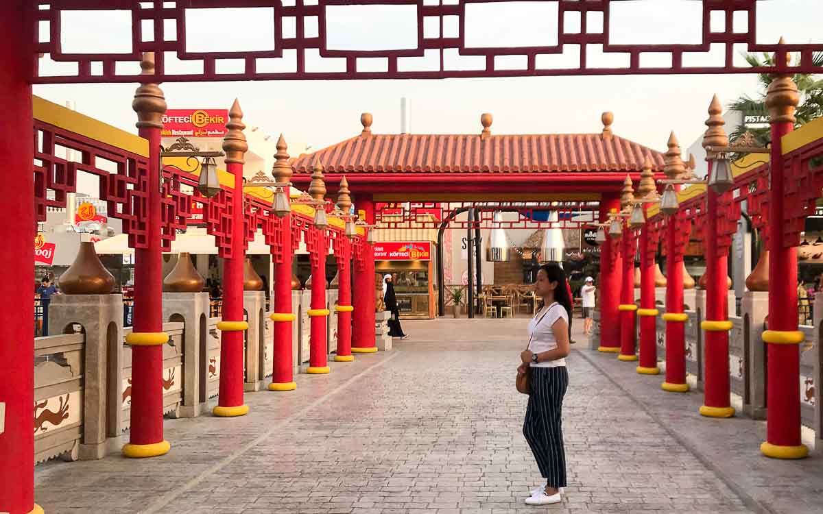 A woman standing on the pathway.