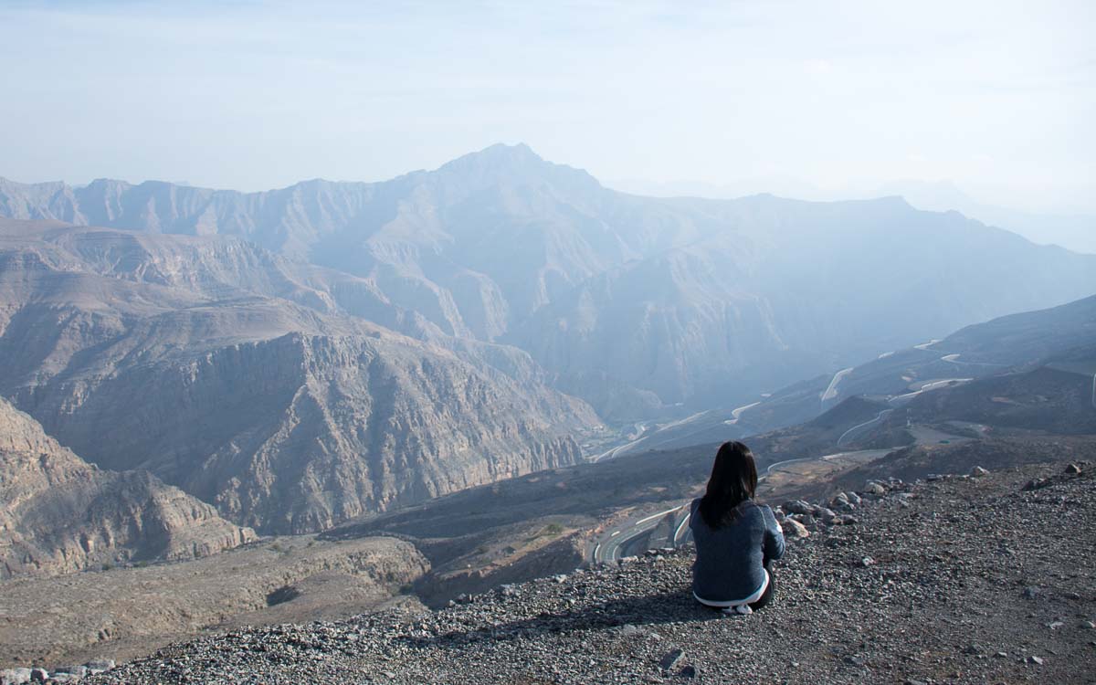 A woman sitting at Jebel Jais mountain