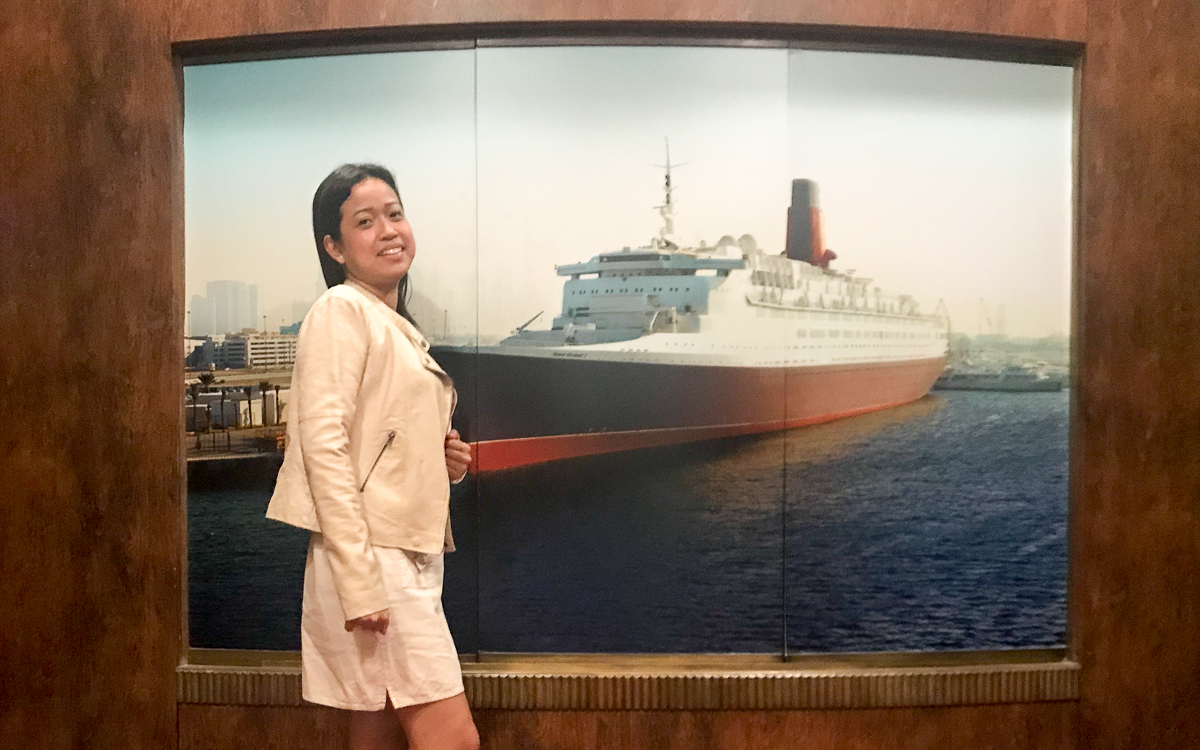 A woman standing in front of a cruise ship wallpaper