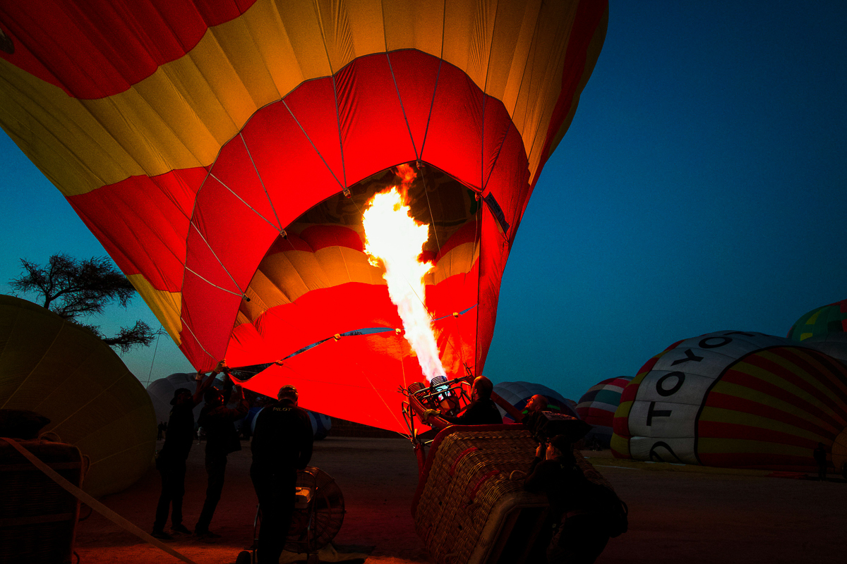 Setting up the hot air balloon in Saudi Arabia at dusk.