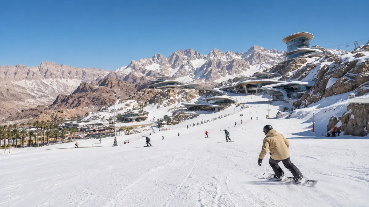 Trojena ski resort in NEOM Saudi Arabia mountain region with skiers on snow slopes