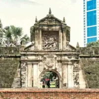 Intramuros Manila Fort Santiago entrance with Spanish colonial architecture and cobblestone path