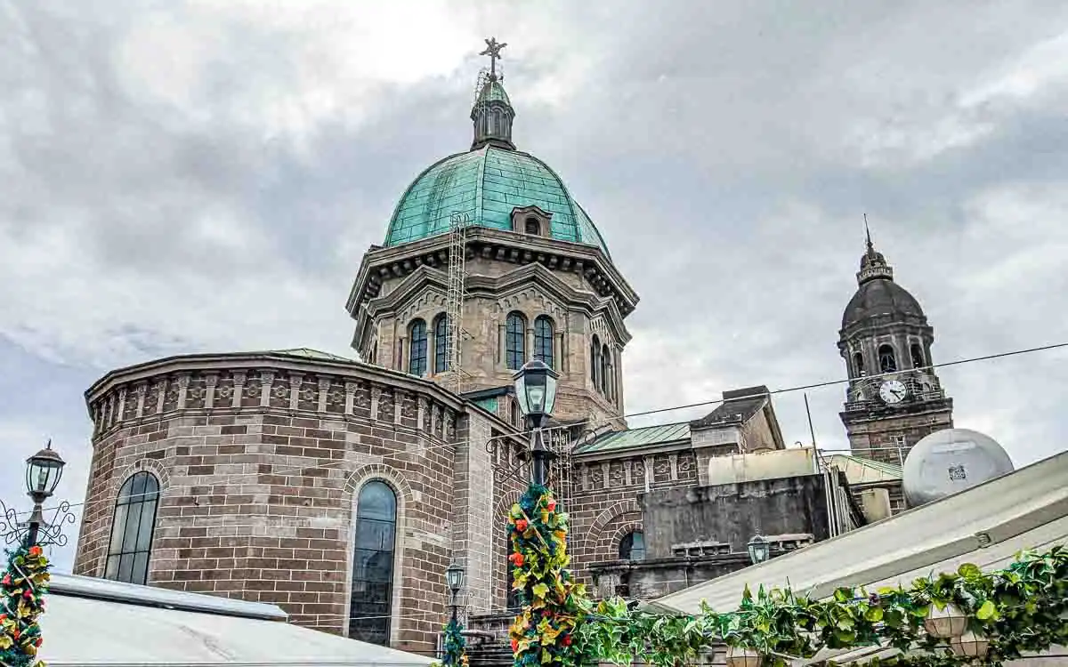 Front view of Manila Cathedral in Intramuros showcasing its Romanesque Revival architecture.