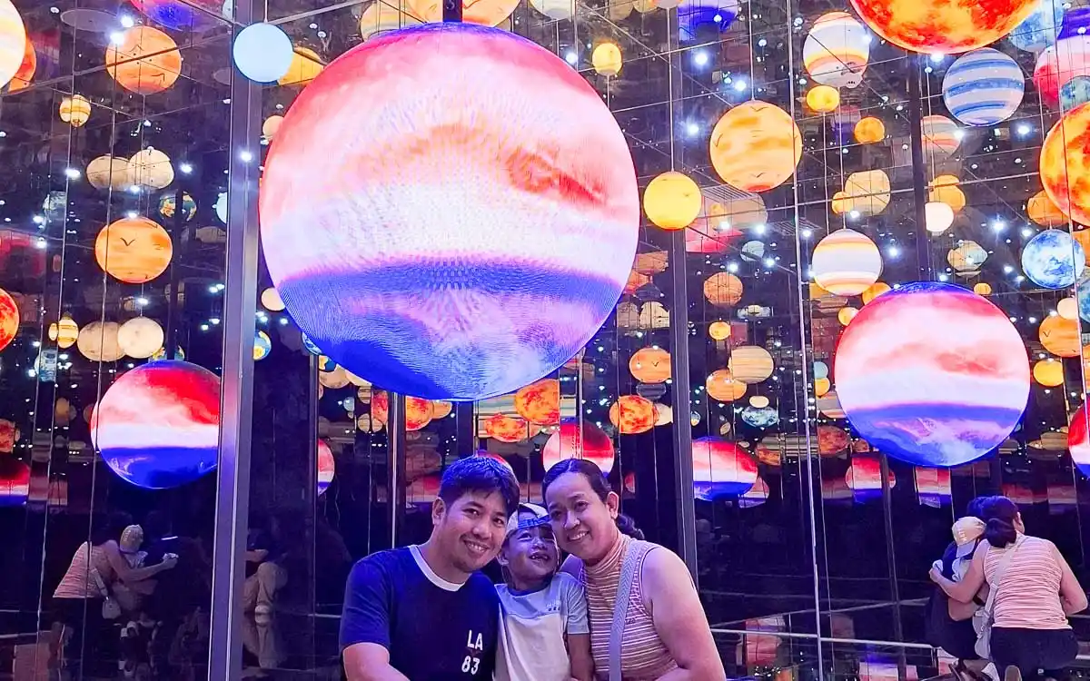 Family inside the Wandering Planet infinity mirror room at Space & Time Cube SM North EDSA
