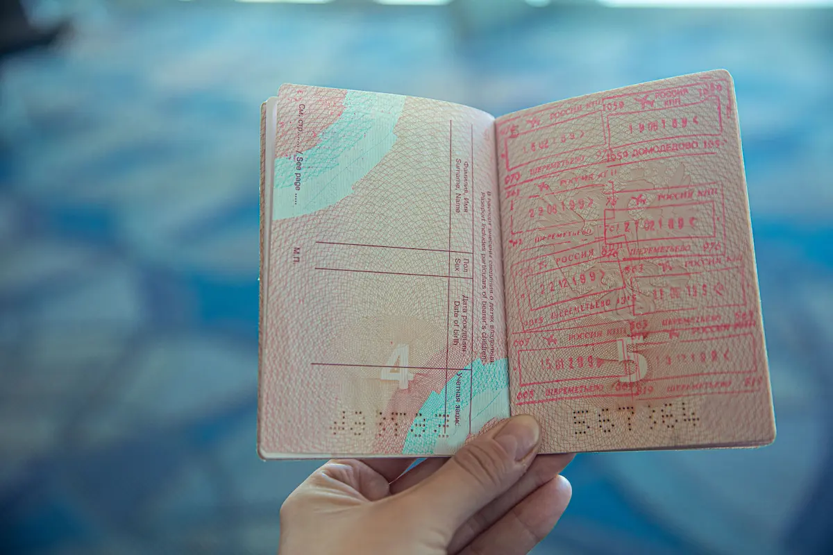 Person holding an opened passport - passport validity reminder